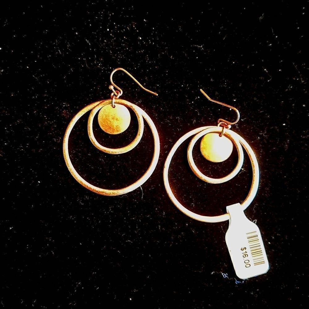 Pair of gold tone hoop earrings. Costume jewelry.
